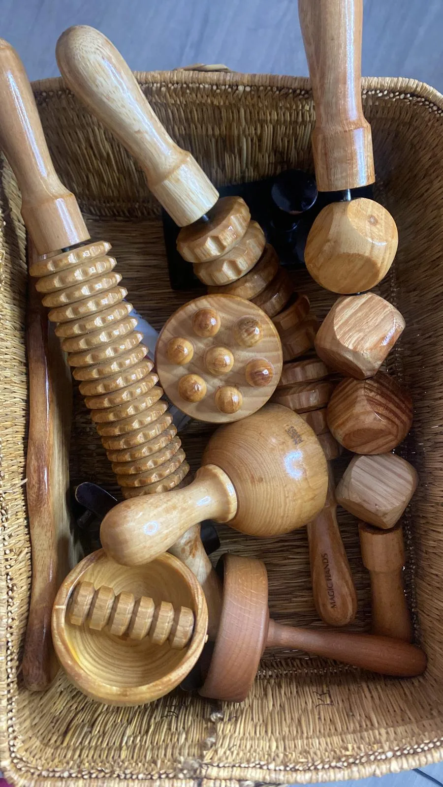 The practice's maderotherapy tools, gathered in a wicker basket